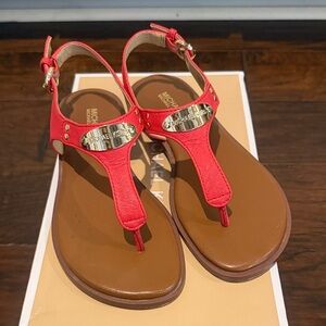 Michael Kors Red T-Strap Sandals with Gold Logo Plate